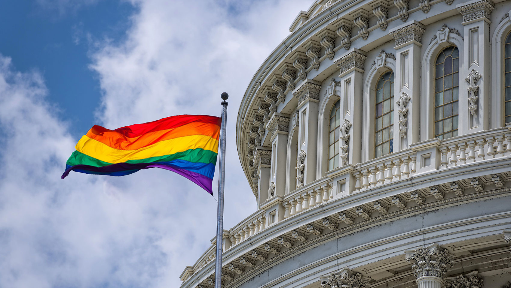 capitol building with pride flag