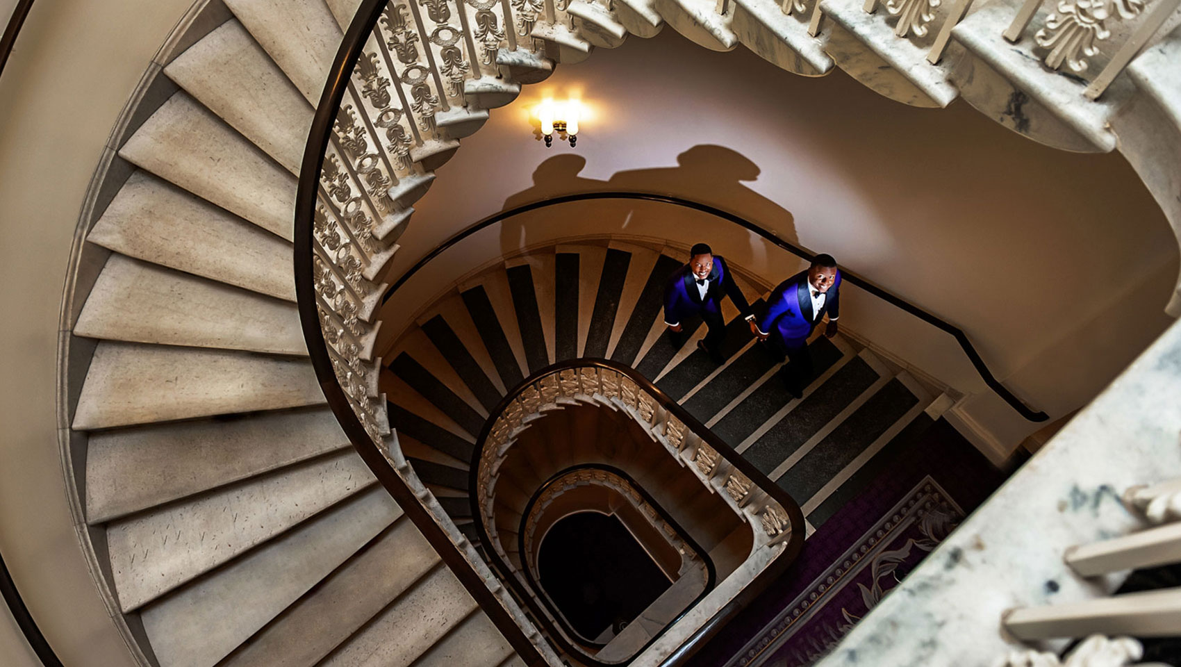 Couple ascends our marble staircase