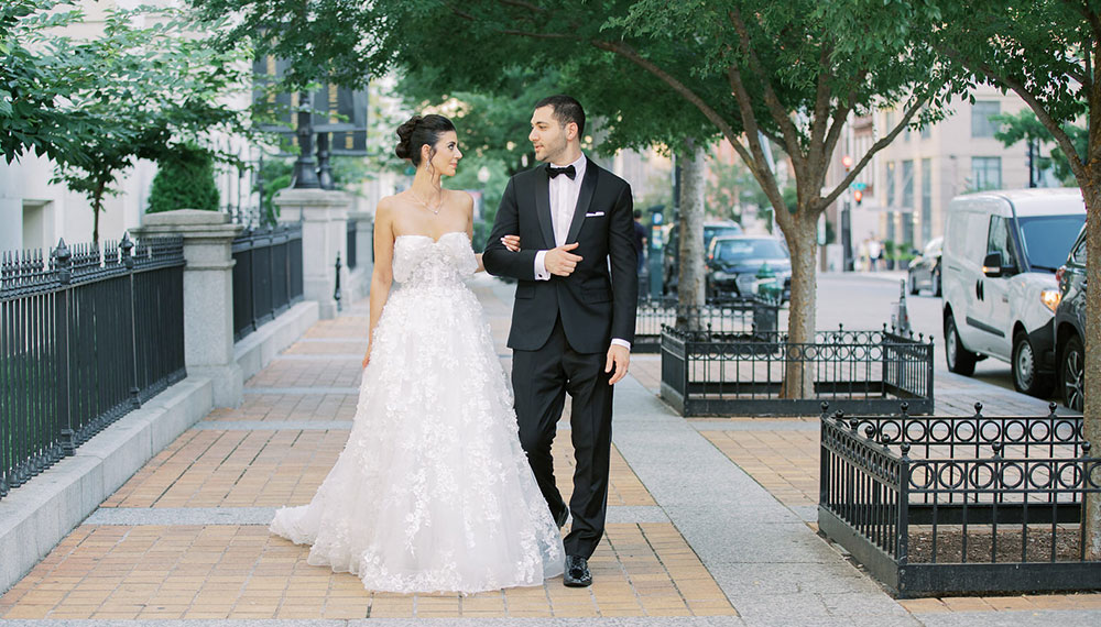 bride and groom walking down DC Street