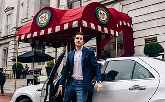 man getting out of car in front of Monaco DC