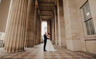 bride and groom with arms around eachother