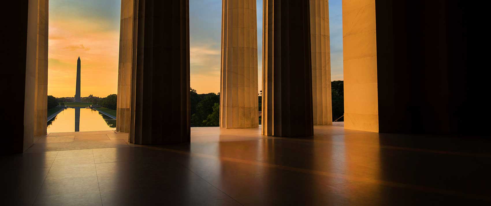Early morning summer sunrise as seen from the Lincoln Memorial while looking toward the Washington Monument in Washington, DC.